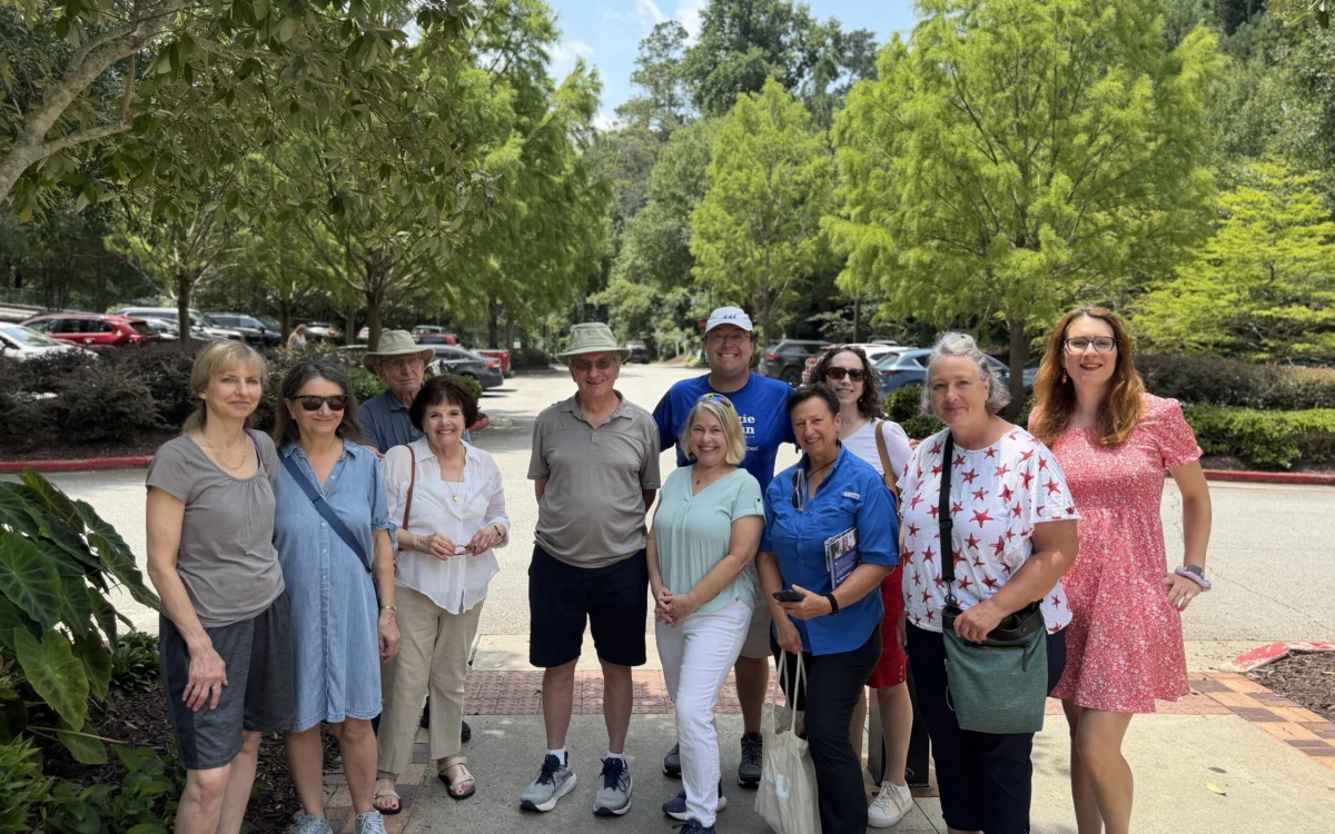 A dozen North Fulton Democrats gathered outdoors on a summer afternoon before heading out to canvass.