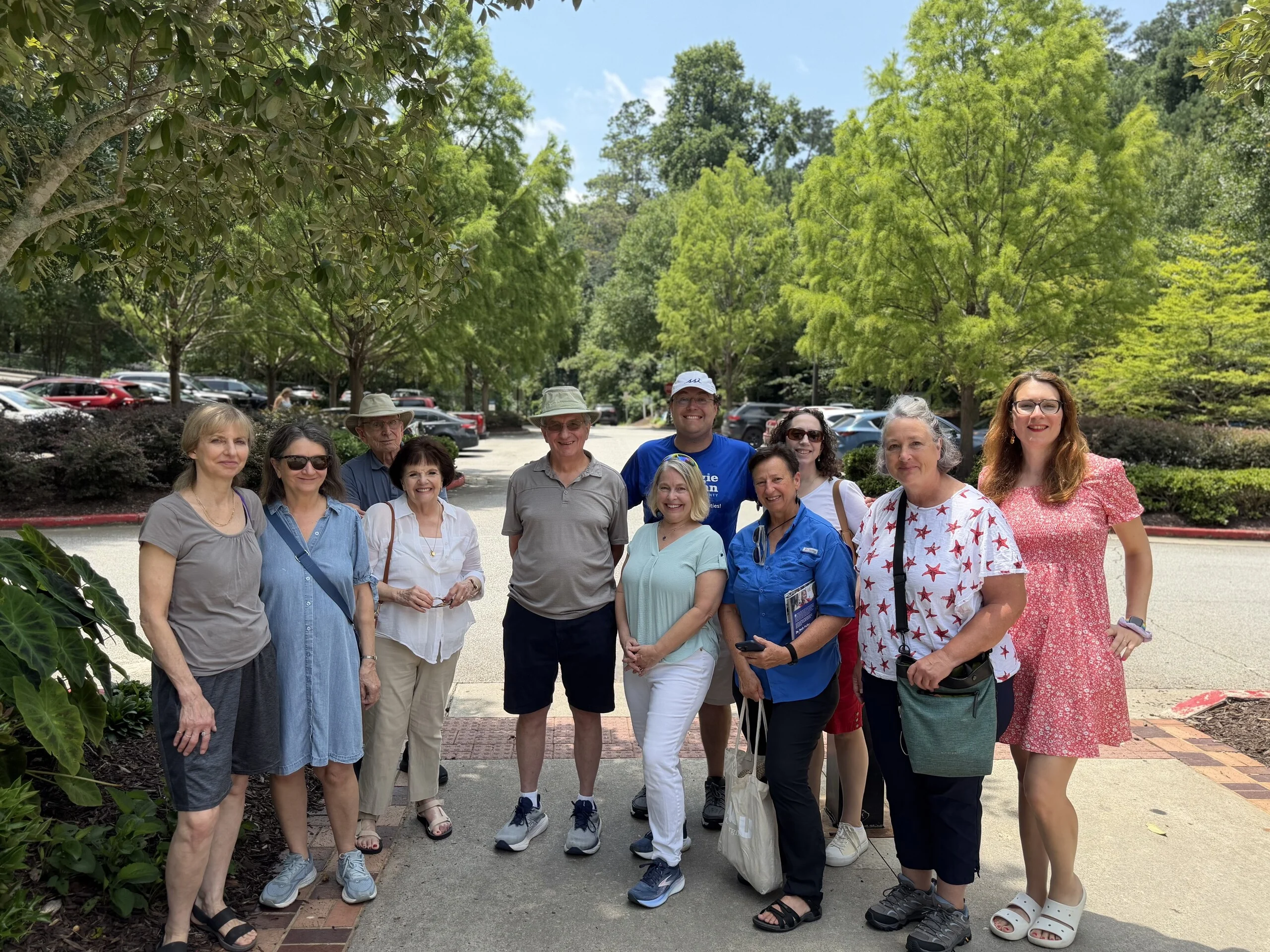 A dozen North Fulton Democrats gathered outdoors on a summer afternoon before heading out to canvass.